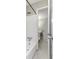 Bathroom featuring a tub shower, with a walk through doorway to a half bathroom with white vanity and mirror at 109 Willowick Dr # 109, Lithonia, GA 30038