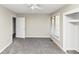 Neutrally decorated and carpeted bedroom with ceiling fan at 109 Willowick Dr # 109, Lithonia, GA 30038