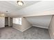 Neutral bedroom featuring soft grey carpet, a window, and ample closet space at 109 Willowick Dr # 109, Lithonia, GA 30038