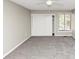 Bedroom with neutral paint and a window showing an exterior view at 109 Willowick Dr # 109, Lithonia, GA 30038