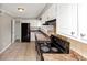 Functional kitchen with black appliances and white cabinets at 109 Willowick Dr # 109, Lithonia, GA 30038