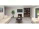 Cozy living room featuring a fireplace, tv, and bookshelf at 109 Willowick Dr # 109, Lithonia, GA 30038