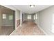 Sun room with neutral walls, paneled accent walls, and tile flooring at 109 Willowick Dr # 109, Lithonia, GA 30038