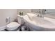 Powder room featuring a pedestal sink, modern faucet, and neutral color scheme at 123 Ledgemont Way, Acworth, GA 30101