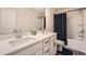 Modern bathroom with a double sink vanity, white countertops, and shower-tub combo at 123 Ledgemont Way, Acworth, GA 30101