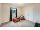 Cozy bedroom featuring plush carpeting, a window with dark curtains, and ample closet space at 123 Ledgemont Way, Acworth, GA 30101