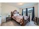 Inviting bedroom with a decorative bed frame, neutral walls, and bright windows at 123 Ledgemont Way, Acworth, GA 30101