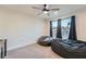 Spacious bedroom with plush carpeting, a ceiling fan, and bright windows with views at 123 Ledgemont Way, Acworth, GA 30101