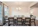 Spacious dining area with a modern chandelier and views into the living area at 123 Ledgemont Way, Acworth, GA 30101
