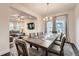 Elegant dining room with a large table, seating for eight, and natural light at 123 Ledgemont Way, Acworth, GA 30101