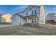 Well-maintained two-story house with a two-car garage and a welcoming front porch at 123 Ledgemont Way, Acworth, GA 30101