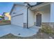 Inviting front porch with stone accents and an attached two-car garage at 123 Ledgemont Way, Acworth, GA 30101