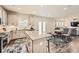 Open-concept kitchen with an island, stainless steel appliances, and adjacent dining and living areas at 123 Ledgemont Way, Acworth, GA 30101