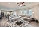 Open-concept living room with a large sectional sofa, seamlessly connecting to the kitchen at 123 Ledgemont Way, Acworth, GA 30101