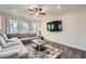 Cozy living room featuring a comfortable sectional sofa, and a ceiling fan at 123 Ledgemont Way, Acworth, GA 30101