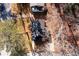 Aerial shot of house with dark roof surrounded by bare trees at 2107 Penrose Dr, Atlanta, GA 30344
