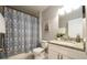 Bathroom with shower and a vanity featuring a granite countertop at 2107 Penrose Dr, Atlanta, GA 30344