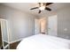 Bedroom with hardwood flooring, ceiling fan, and a decorative floor mirror at 2107 Penrose Dr, Atlanta, GA 30344