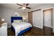 Comfortable bedroom features hardwood floors, ceiling fan, and sliding barn door at 2107 Penrose Dr, Atlanta, GA 30344