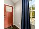 Entryway featuring a stylish front door, dark hardwood floors, and modern accents at 2107 Penrose Dr, Atlanta, GA 30344