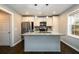 Modern kitchen with granite countertops, stainless steel appliances, and a stylish center island at 2107 Penrose Dr, Atlanta, GA 30344
