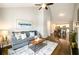 Comfortable living room with vaulted ceilings flowing into the dining area and kitchen at 2107 Penrose Dr, Atlanta, GA 30344
