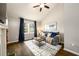 Cozy living room with vaulted ceilings, a ceiling fan, and a large window with curtains at 2107 Penrose Dr, Atlanta, GA 30344