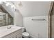 This attic bathroom features a sink with storage cabinet and a glass enclosed shower with tiled walls at 305 Inman Pl, Roswell, GA 30075