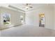 Bright bedroom with carpet, neutral walls, and large windows providing natural light and outdoor views at 305 Inman Pl, Roswell, GA 30075