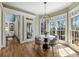 Bright breakfast nook with a round table, four chairs, and natural light at 305 Inman Pl, Roswell, GA 30075