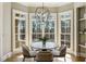 Charming breakfast nook with round table and four chairs at 305 Inman Pl, Roswell, GA 30075