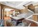 Open concept game room with pool table, wet bar, and staircase leading to another level at 305 Inman Pl, Roswell, GA 30075