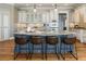 Gourmet kitchen with large center island, granite countertops, and modern appliances at 305 Inman Pl, Roswell, GA 30075