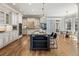 Bright kitchen with stainless steel appliances, island with bar seating, and open dining area at 305 Inman Pl, Roswell, GA 30075