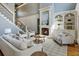 Inviting living room with fireplace, built-ins, and staircase to the second level at 305 Inman Pl, Roswell, GA 30075