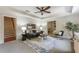 Inviting living room with staircase access, a comfortable sofa, stylish rug, and view of a bedroom at 305 Inman Pl, Roswell, GA 30075