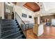 Living room with hardwood floors, stairs, and wet bar with granite counters at 305 Inman Pl, Roswell, GA 30075