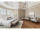Spacious main bedroom with hardwood floors, sitting area, and ample natural light at 305 Inman Pl, Roswell, GA 30075