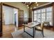 Office with hardwood flooring, shelving, desk with chairs, and large windows at 305 Inman Pl, Roswell, GA 30075