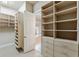Custom walk-in closet with built-in shelving and ample storage space at 305 Inman Pl, Roswell, GA 30075