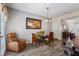 Comfortable dining room featuring a glass top table and seating, and a view of the kitchen at 345 Timber Gate Court, Lawrenceville, GA 30045