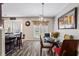Cozy dining area with a glass top table, counter seating, and bright windows overlooking the yard at 345 Timber Gate Court, Lawrenceville, GA 30045