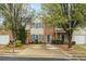 Charming townhouse with brick and siding, well-maintained landscaping, and inviting curb appeal at 345 Timber Gate Court, Lawrenceville, GA 30045
