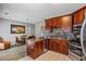 Stylish kitchen with granite countertops, stainless steel appliances, and wood cabinets with ample storage at 345 Timber Gate Court, Lawrenceville, GA 30045