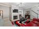 Inviting living area with a fireplace, modern decor, and seamless transition to the dining space at 345 Timber Gate Court, Lawrenceville, GA 30045