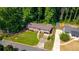 Aerial view of the home highlighting its well-maintained lawn and mature trees at 3819 Dora Se Dr, Smyrna, GA 30082