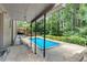 Backyard displaying a swimming pool and a covered patio area at 3819 Dora Se Dr, Smyrna, GA 30082