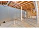 Unfinished basement displaying block wall, concrete floor, and visible pipes at 3819 Dora Se Dr, Smyrna, GA 30082