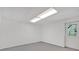 An unfinished basement area with a door and window at 3819 Dora Se Dr, Smyrna, GA 30082