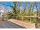 Outdoor deck overlooking a lush yard with trees providing shade at 3819 Dora Se Dr, Smyrna, GA 30082